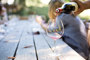 wine being poured into a glass 